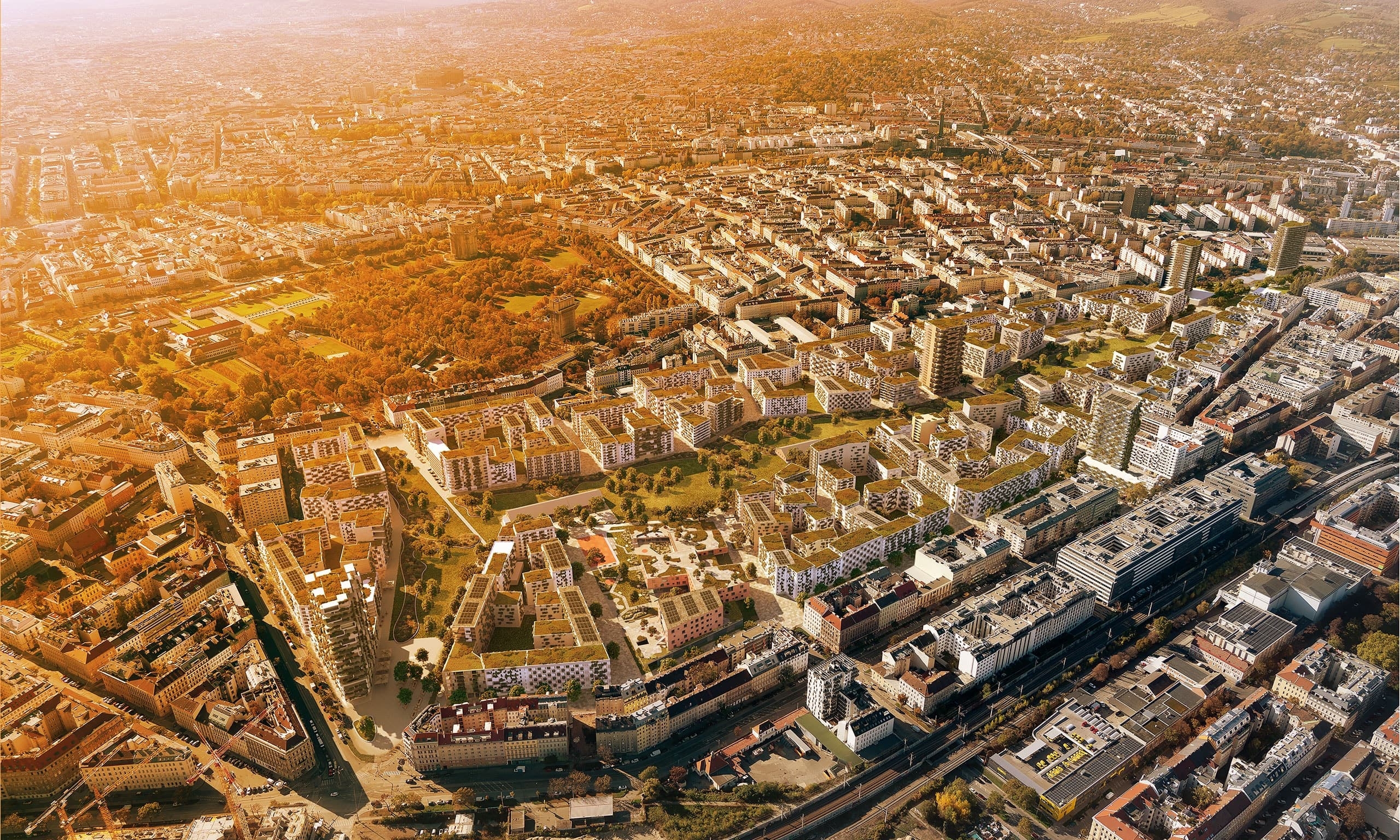 Die Sonne strahlt in intensivem Orange über das Nordwestbahnareal von Wien.